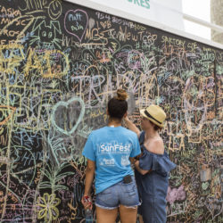 patrons and chalk wall